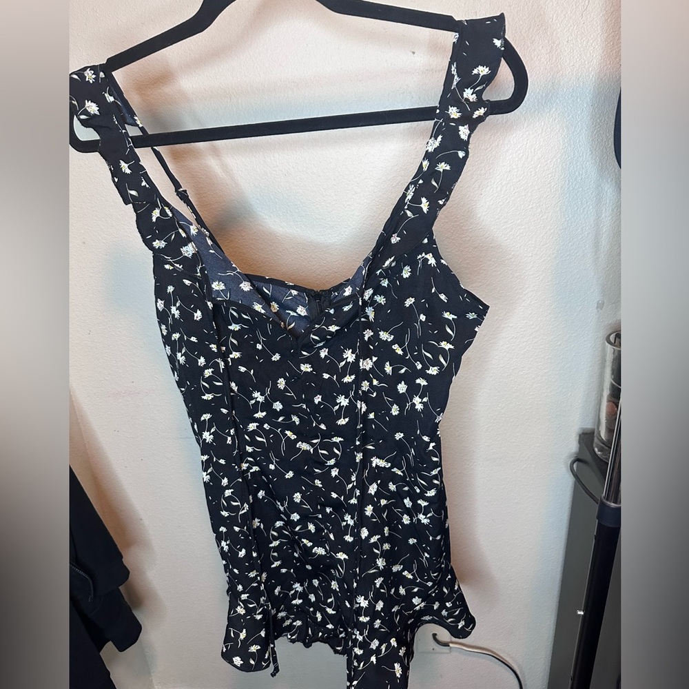 Black romper with white flowers